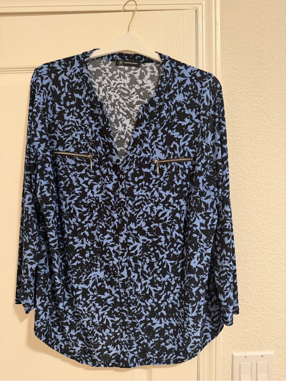 INC 2X blouse — blue/black leaf print, long sleeve with silver zipper details.
